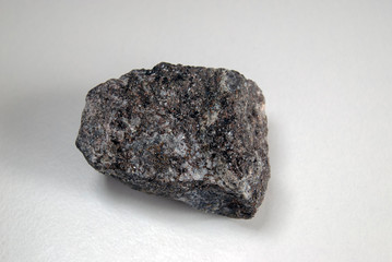  A sample of sphalerite in the rock on a gray background. Origin: Altai.