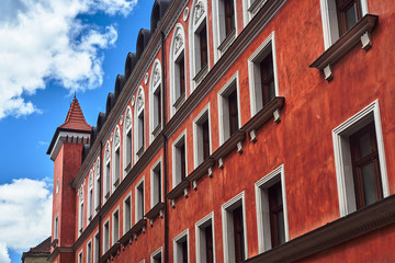 Fototapeta na wymiar facade of the townhouse with tower in Poznan
