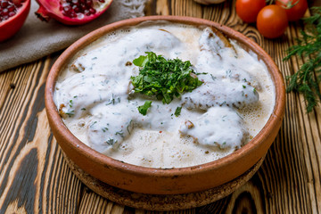 chicken chkmeruli in Georgian on wooden background