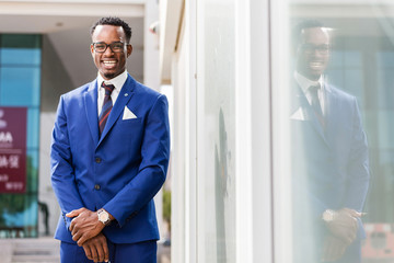 Outdoor standing portrait of a black African American business man