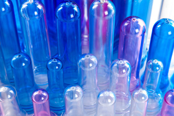 The various type of plastic bottle product and preform material with white background