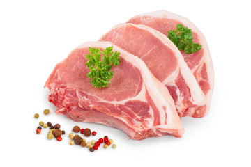 sliced raw pork meat with parsley and peppercorn isolated on white background
