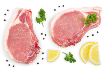 sliced raw pork meat with parsley and lemon isolated on white background. Top view. Flat lay