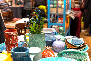 Handmade ceramics on the market. Mugs, plates