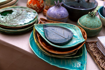 Handmade ceramics on the market. Mugs, plates