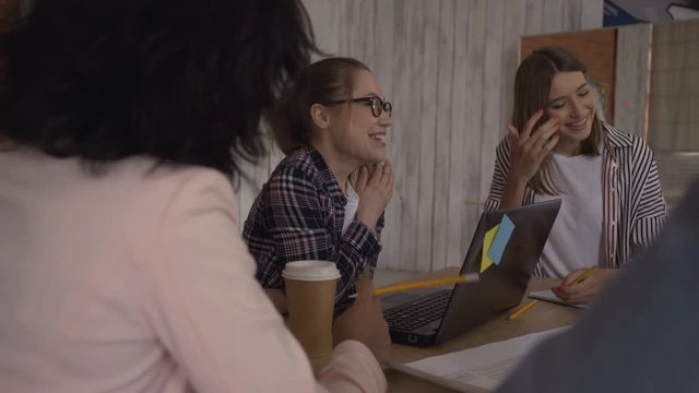 bright cheerful cheerful women laugh at the meeting. 4K