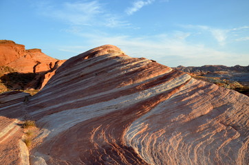 red and white-striped rock in Valley of Fire State Park, Nevada, sunset orange light