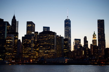 new york city downtown manhattan skyline at dusk, city lights