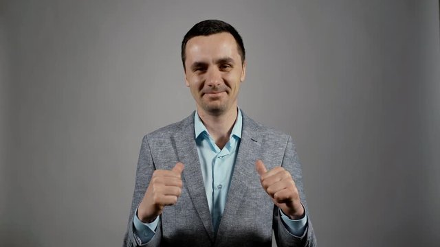Closeup portrait of young business man smugly shows his superiority and points to himself with his double thumbs looking into the camera on white background. Charismatic actor play concept of emotions