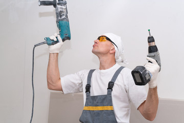 The crazy neighbor drills the ceiling in his apartment with a perforator, in spite of all the neighbors. Breaking the law on silence