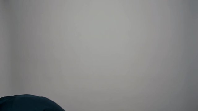 Closeup portrait of a young man feels bad and starts to throw up in front of the camera on a white background. Charismatic actor play concept of emotions