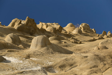 Sand formations in the mountains of the Black Sea coast. Fantastic landscape of extraterrestrial origin. The remains of ancient fairy-tale creatures. Natural sculptures made by wind and water.