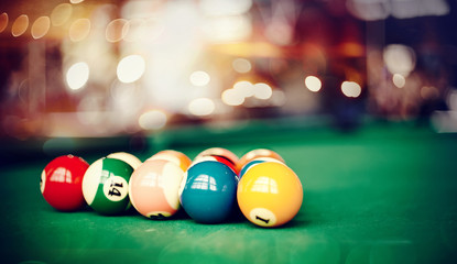 Colorful billiard balls on a billiard table.