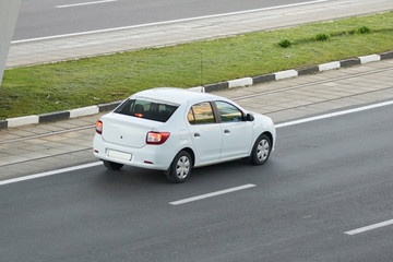 Fototapeta na wymiar Passenger car white rear view