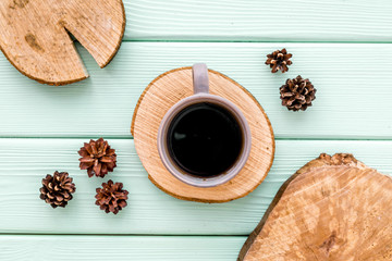 coffee, wooden stumps and pine cones for blog background top view