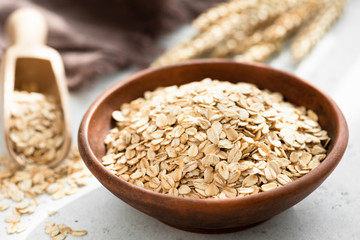 Oat flakes, rolled oats in bowl. Dry breakfast cereals. Healthy eating, healthy lifestyle concept