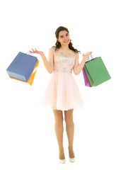 Fototapeta premium Teenager girl shopping in a store with large paper bags.