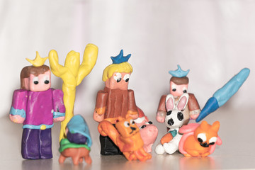 The figures of people of clay. Multicolored plasticine