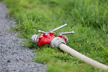 Naklejka premium portable hydrant with a hose
