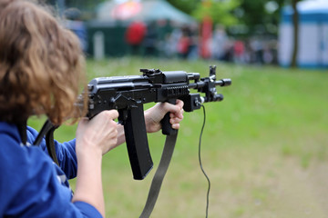girl shooting from a pneumatic rifle