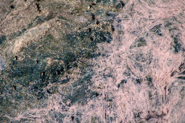 Pink and green texture of polluted water