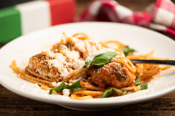 Beef meatballs with bolognese sauce and spaghetti.