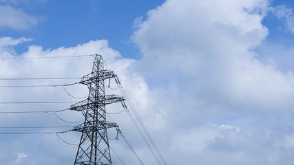 power transmission tower on background of blue sky