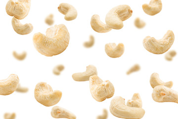 Fototapeta na wymiar Falling cashew nut isolated on white background, selective focus