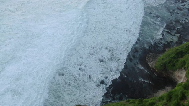 Top view of the giant waves, foaming and splashing in the ocean Bali, Indonesia