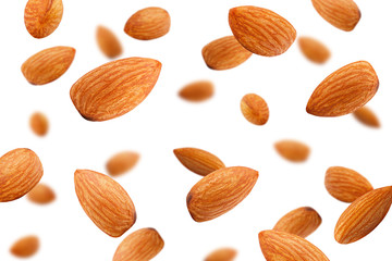 Falling almond isolated on white background, selective focus