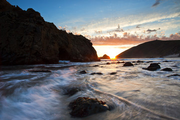 sunset on beach in big sur california