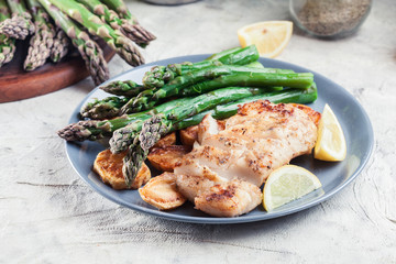 Fried cod fillet with green asparagus