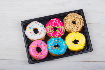assorted donuts with different fillings in the box
