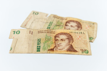 Used and broken 10 Pesos argentinian banknotes