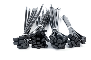 Black nylon cable ties on a white background