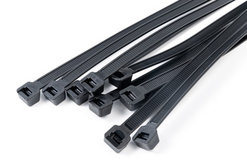 Black nylon cable ties on a white background