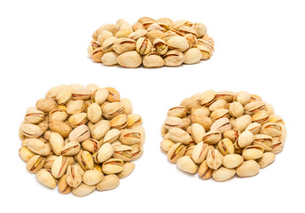 Set of handfuls of nuts from different angles - pistachio nuts (Pistacia vera) in the shell, close up, isolated on white background