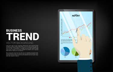 close up businessman hand touch business graph report in tablet. Concept for digital business growth and trend report