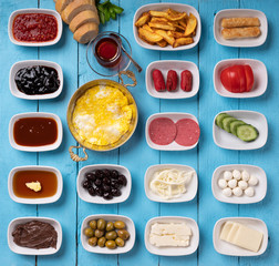 Traditional Turkish breakfast with classic fried omelette on turquoise wooden background