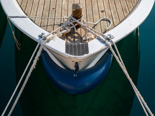 Bow of a small fishing boat with ropes