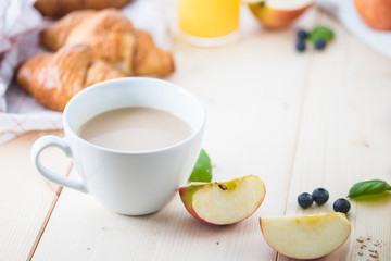 Breakfast on a wooden simple table.. Croissants Breakfast with aromatic tast. Good morning, great start to the day.