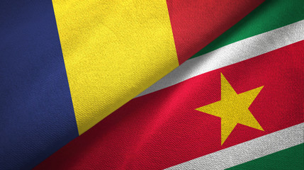 Fototapeta premium Chad and Suriname two flags textile cloth, fabric texture