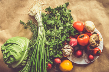 Healthy food background. Assortment of fresh vegetables on paper background