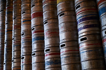 Steel beer barrels wall background texture, close-up