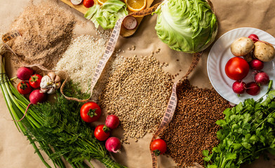 Organic food background with cutting board and lemon slices
