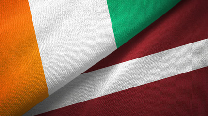 Cote d'Ivoire and Latvia two flags textile cloth, fabric texture