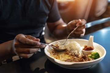 Men are eating food on his vacation.
