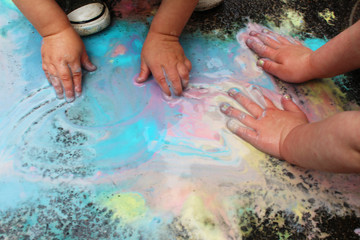 Ice sidewalk paint preparation and use in a daycare/home school setting. Fun childhood STEM and art activity. Messy fun. Science. 