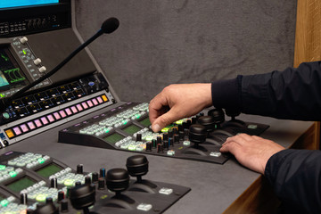 Video Director at the editing control panel, live broadcast, live broadcast