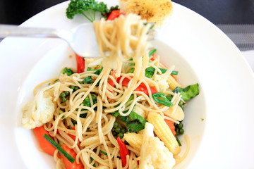 Close up italian spaghetti in white plate.